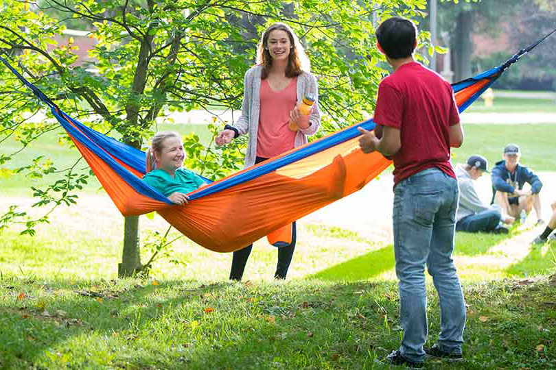 Students around hammock