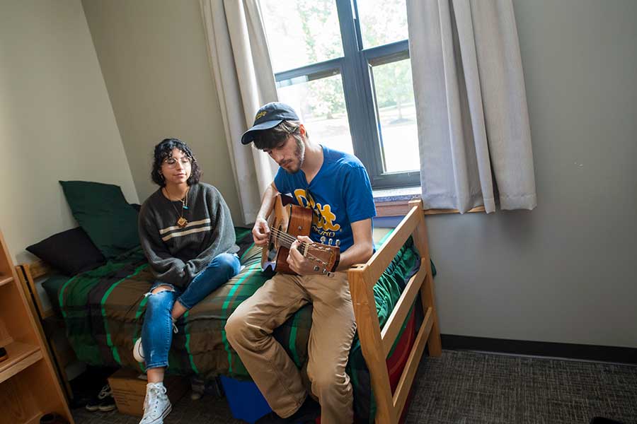 Student playing guitar