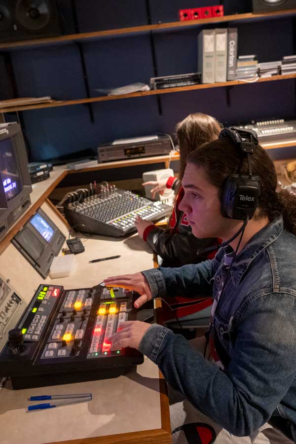 Student in broadcast booth