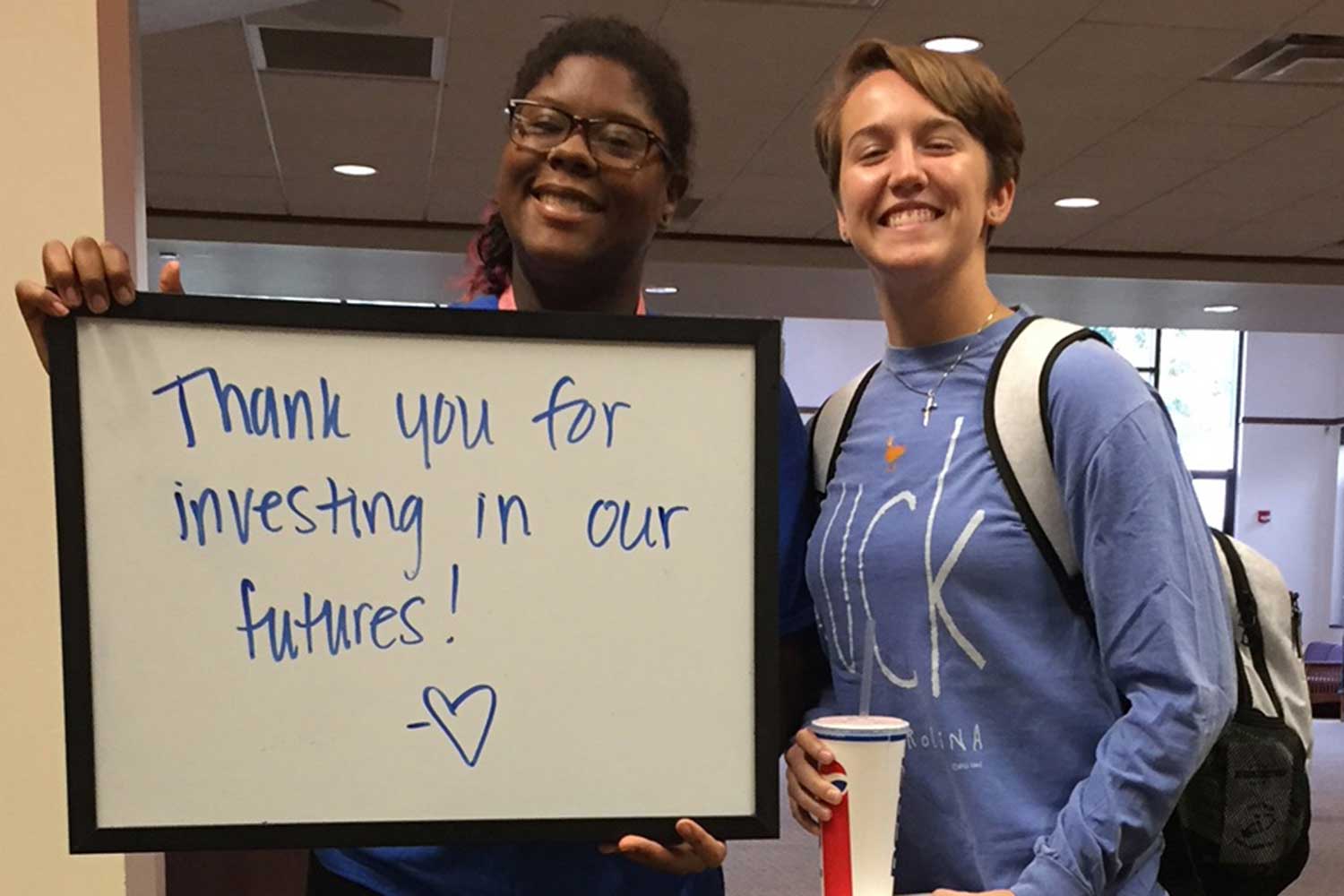 Students with thank you sign