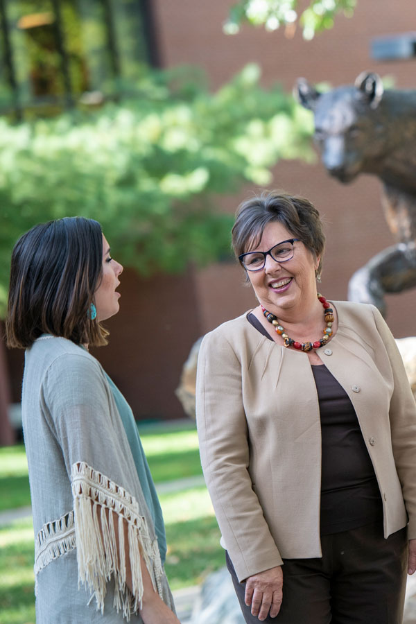 President Koverola with student
