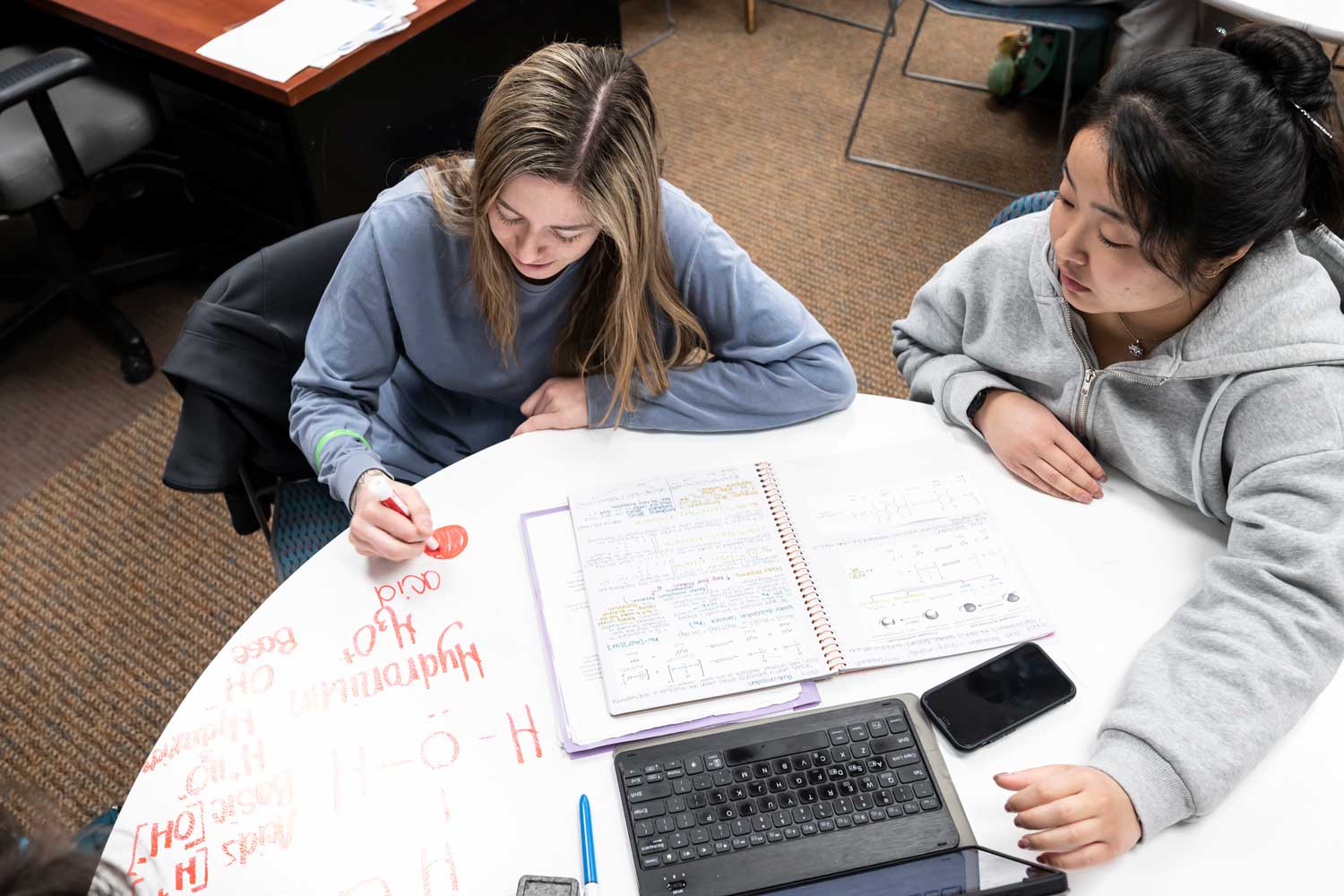 Two students working together in trio