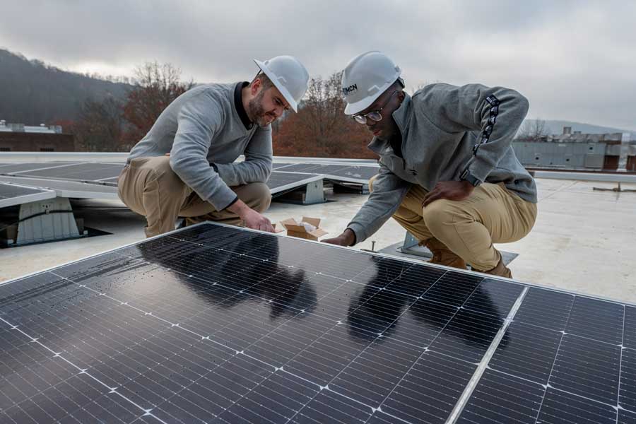 People working on solar panels