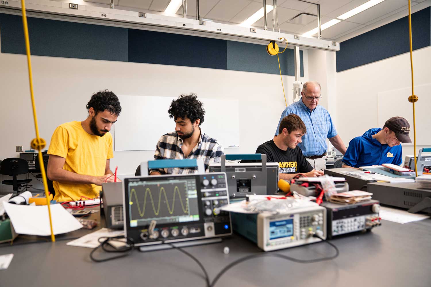 Students using equipment in the Electronics Lab