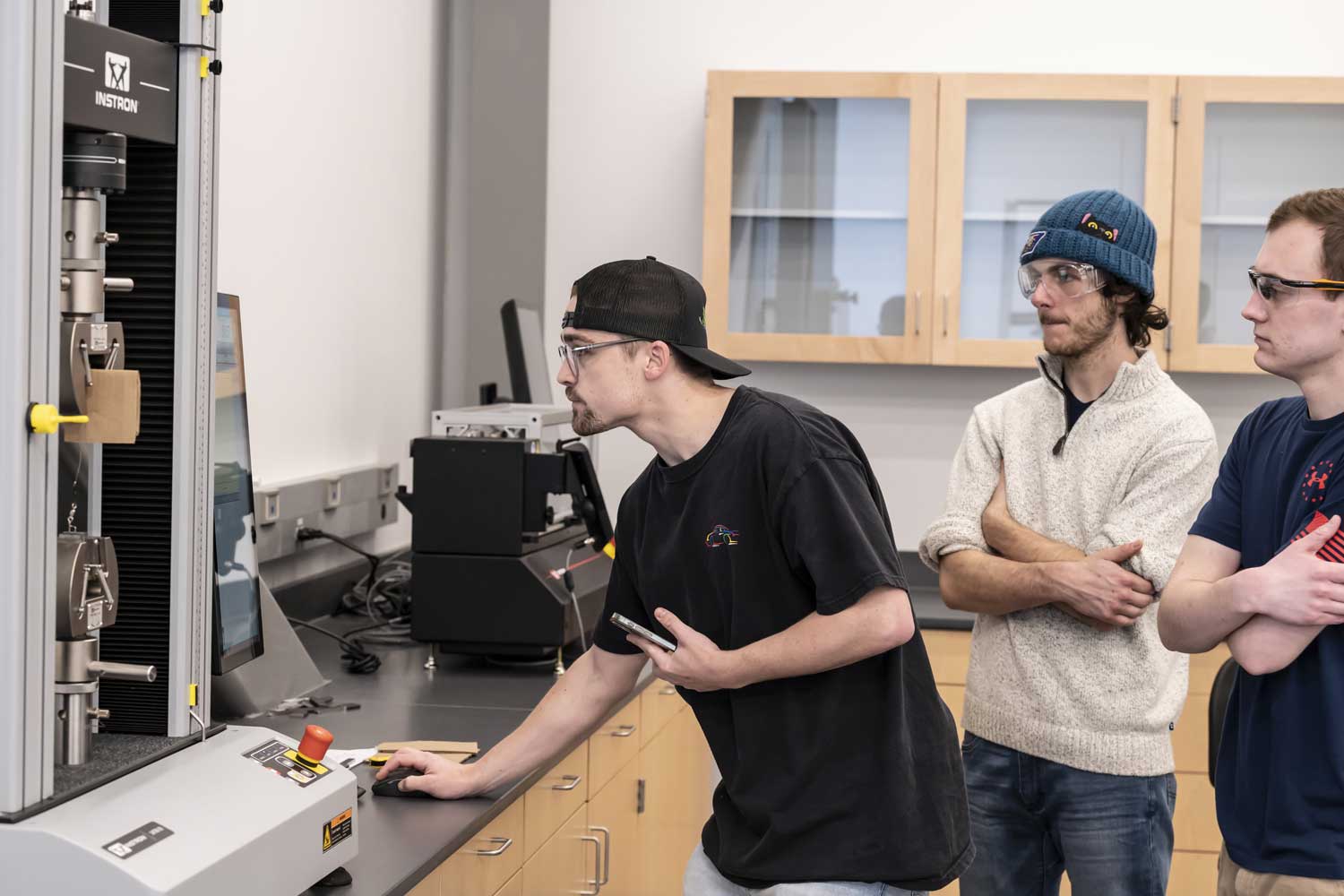 Students testing material in the Strengths of Materials Lab