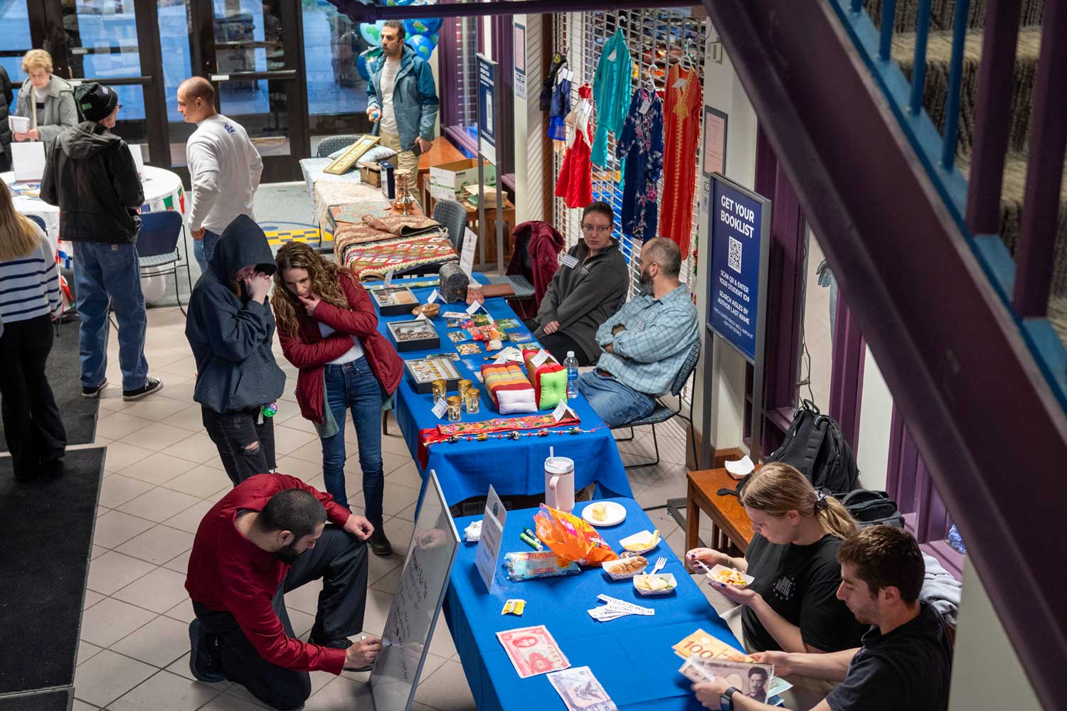 Overhead image of multiple tablesand people representing different cultures