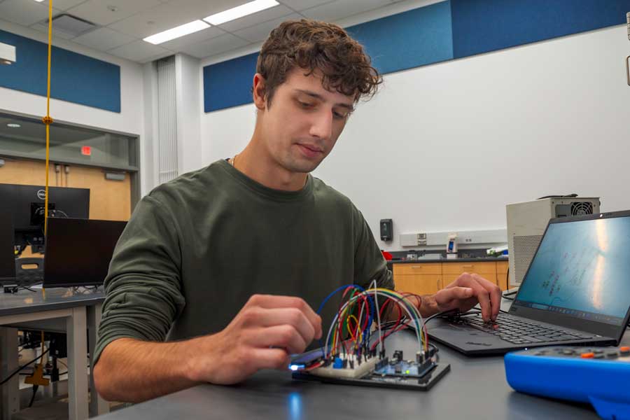 Student working with equipment