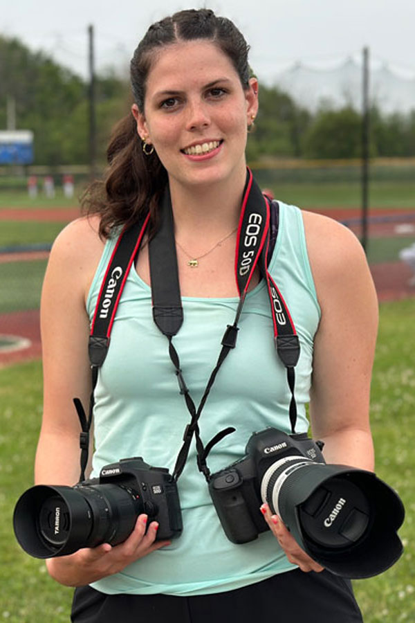 Brooklyn on the field taking photos