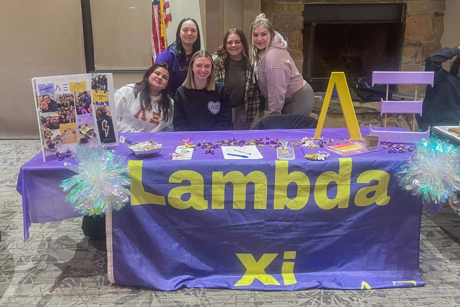 Lambda Xi Greek organization table at club night