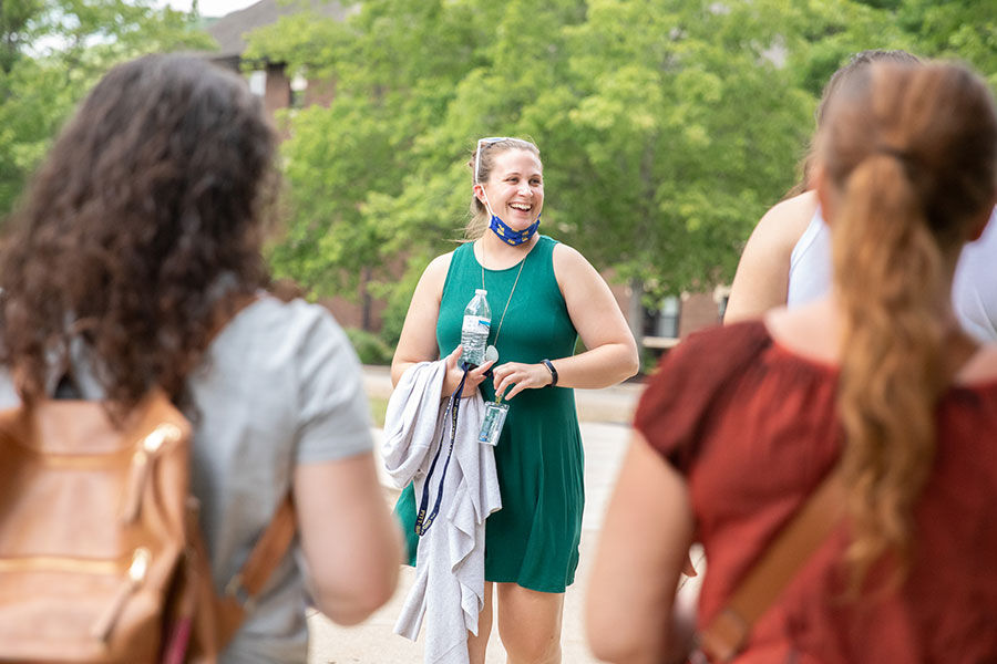 Admissions couselor guiding a tour