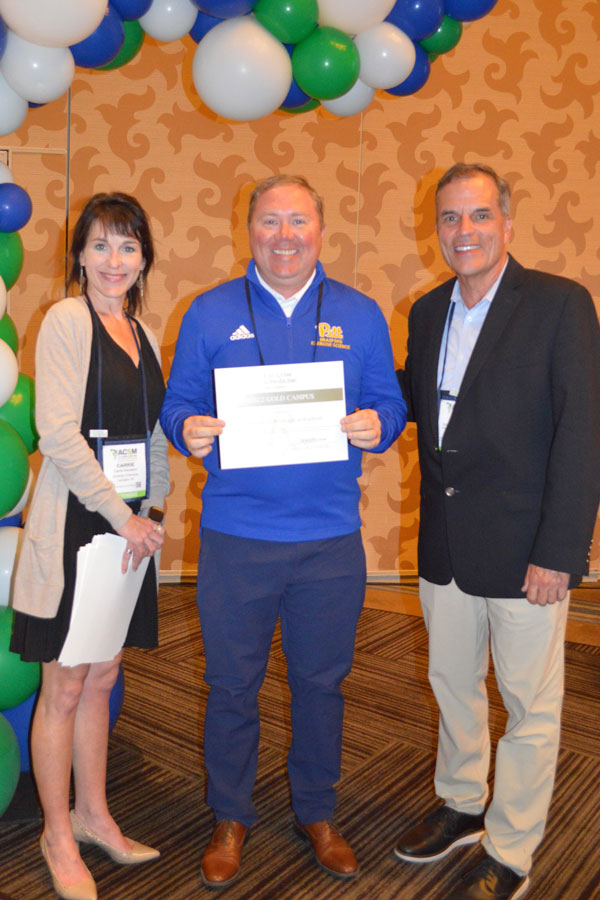 Dr. Mark Kelley receiving award.