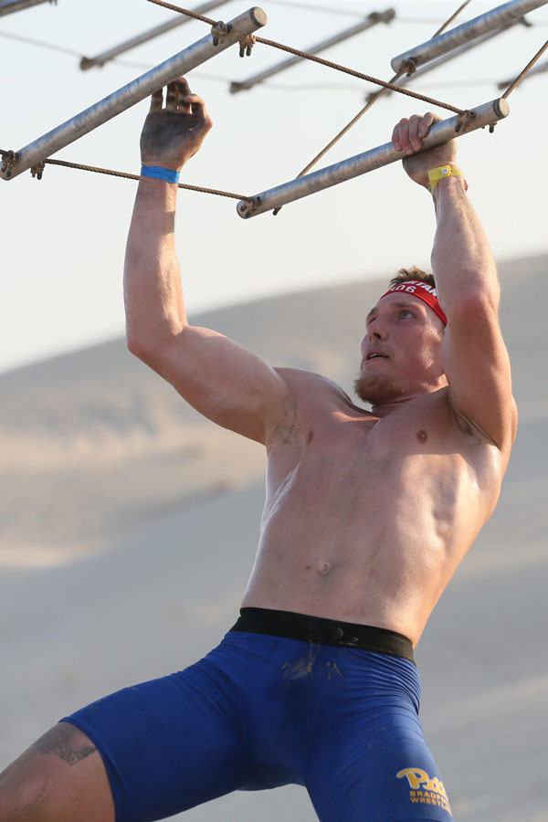  Senior Tyler Newton taking on the apehanger apparatus at the 2022 Spartan Elite World Championship in Abu Dhabi. (Spartan photo)