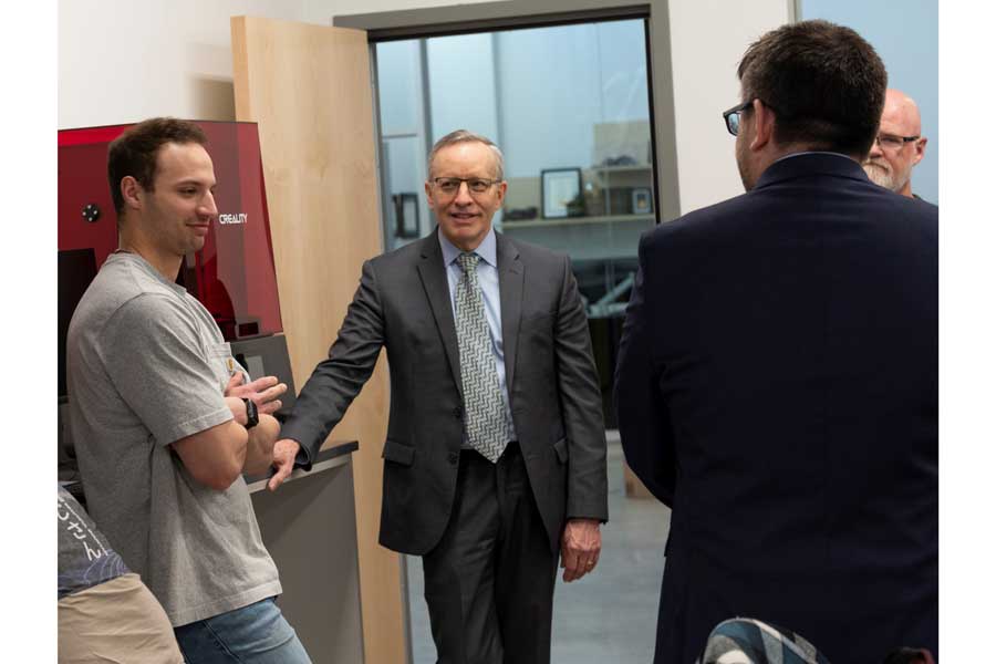 President Esch and others in the makerspace