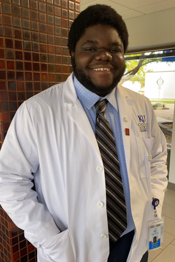 Olubumi Braimah in a lab coat