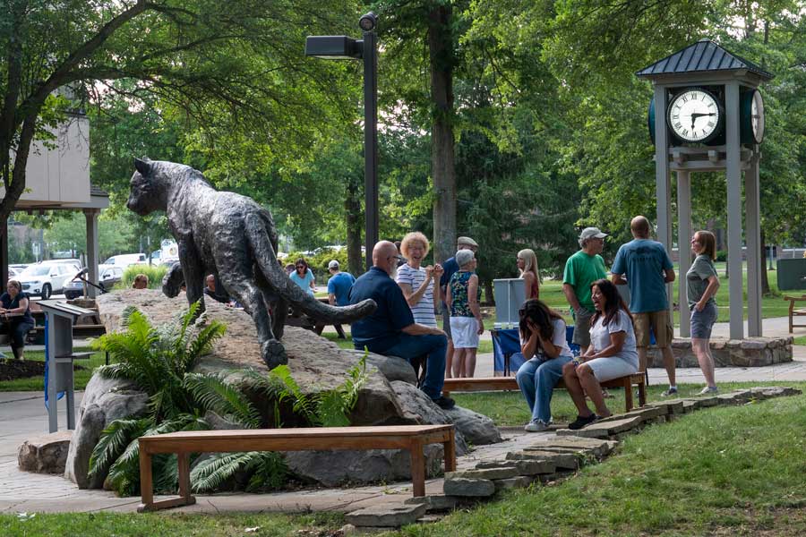 People in the quad talking during the community cookout