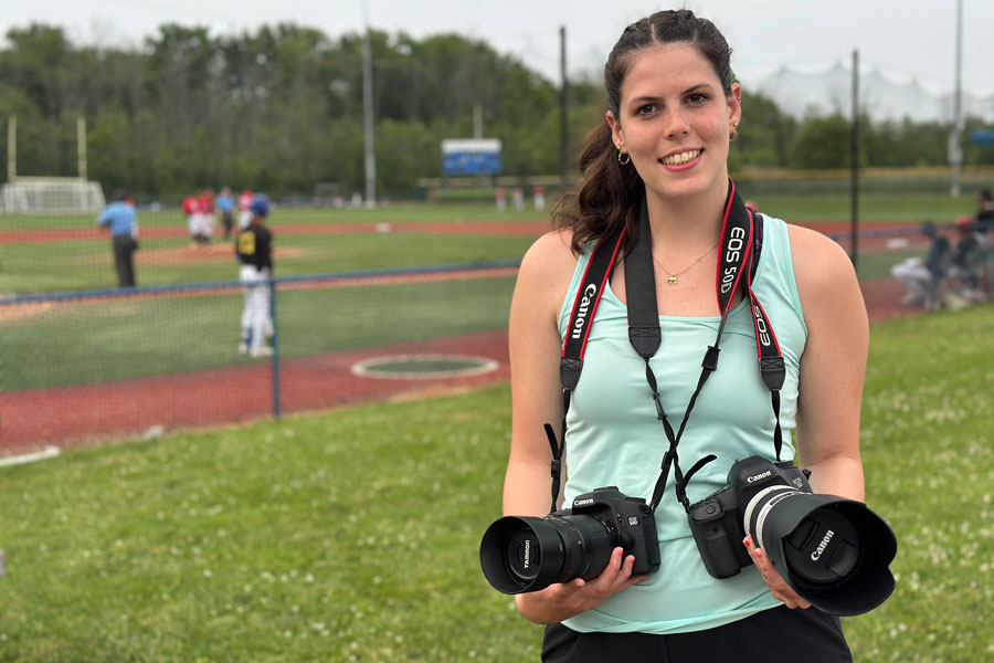 Brooklyn on the field taking photos