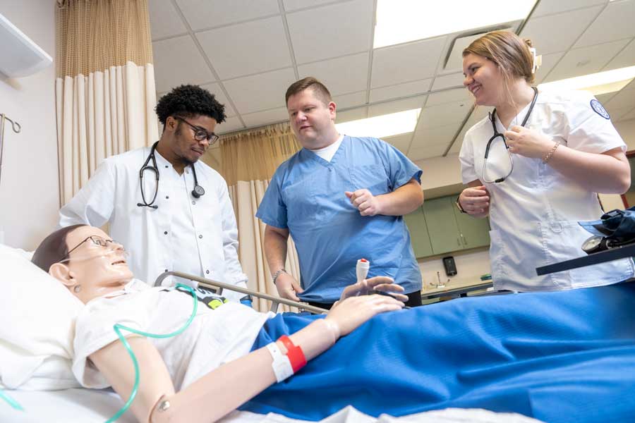 Students practicing nursing techniques