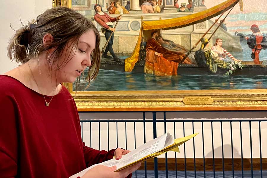 A girl reading a script for a play