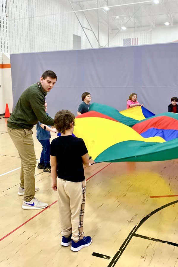 Chad Carlson working with students