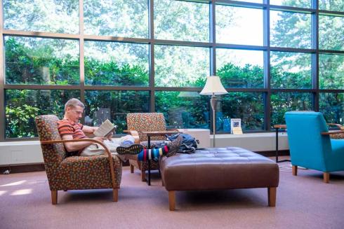 Student reading in library