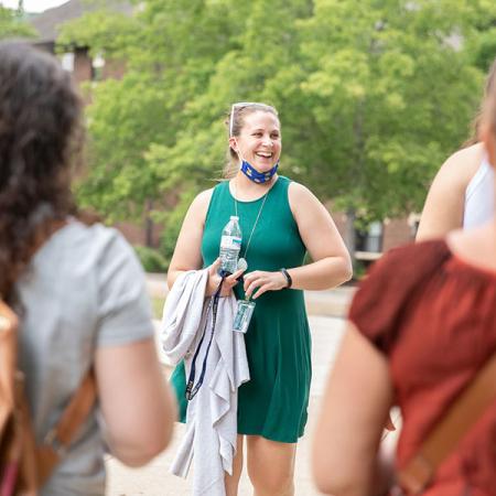 Admissions couselor guiding a tour