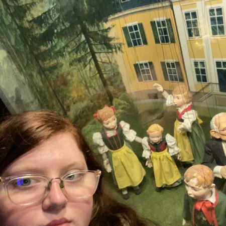 Alia Mosier in front of some marionettes